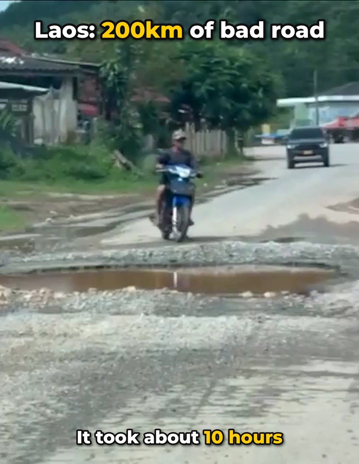 Potholed dirt road in Laos on the route from Malaysia to China