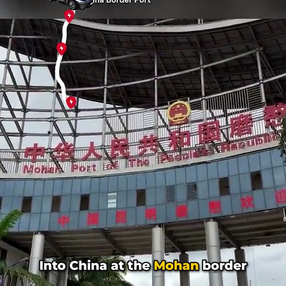 Mohan border port gate on the Laos-China border, crossed by a Malaysian Tesla driver